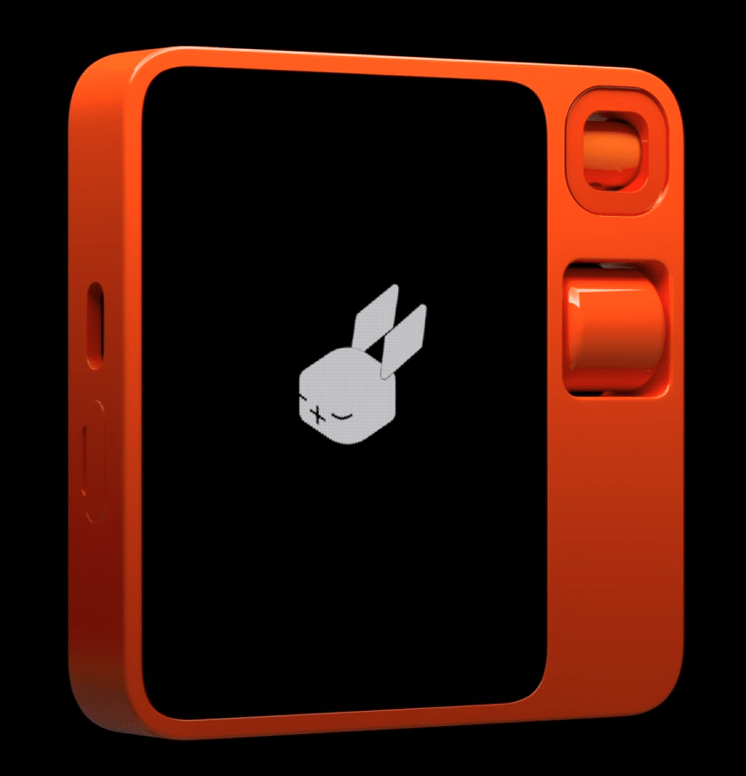 Rabbit R1 - A small square orange rectangle device with a touch screen and scrollwheel.