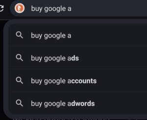 Auto complete suggestion showing "buy Google accounts" on DuckDuckGo search.